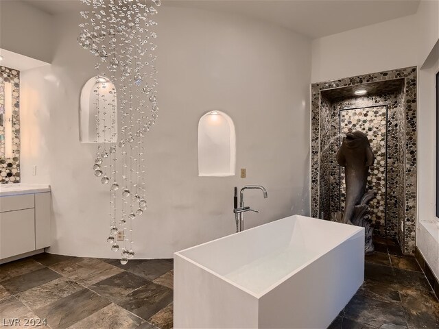 bathroom featuring tile floors and vanity