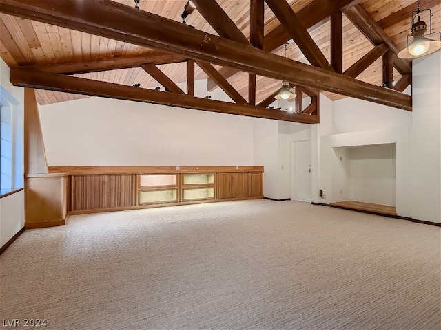 additional living space with beam ceiling, high vaulted ceiling, light carpet, baseboards, and wood ceiling