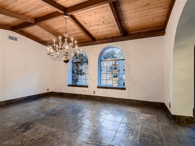 unfurnished dining area with stone tile flooring, visible vents, and baseboards