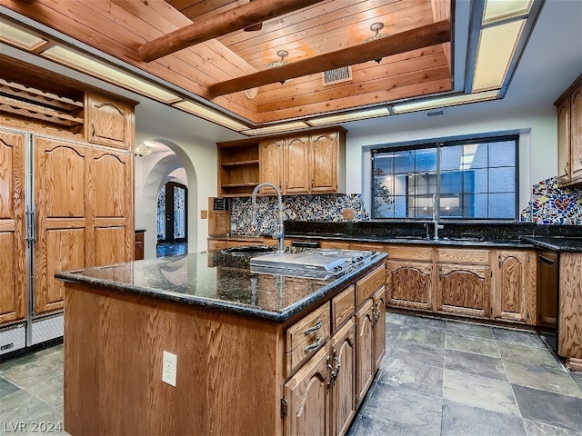 kitchen featuring open shelves, a sink, cooktop, wood ceiling, and tasteful backsplash