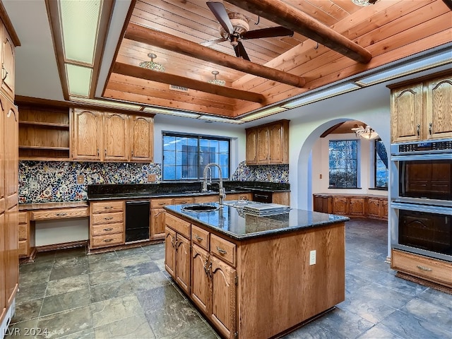 kitchen with double oven, wood ceiling, decorative backsplash, arched walkways, and open shelves