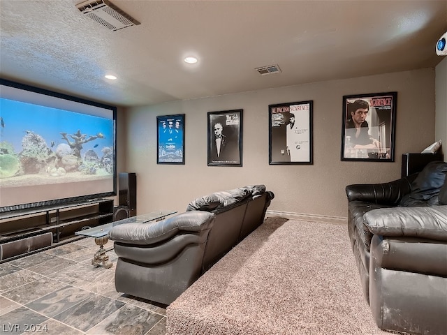 cinema featuring recessed lighting, visible vents, baseboards, and a textured ceiling