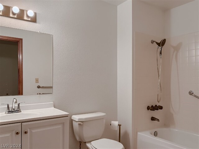 full bathroom featuring vanity, toilet, and tiled shower / bath combo