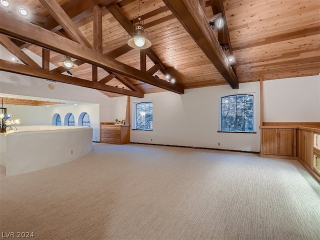 interior space featuring beamed ceiling, light carpet, wood ceiling, and a chandelier