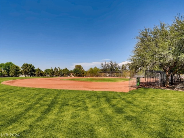 view of community with a lawn and volleyball court