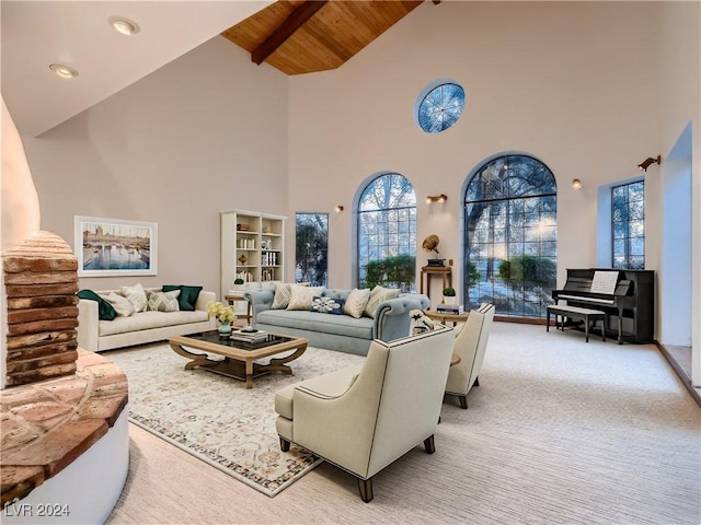 living area with light carpet, wooden ceiling, and lofted ceiling with beams