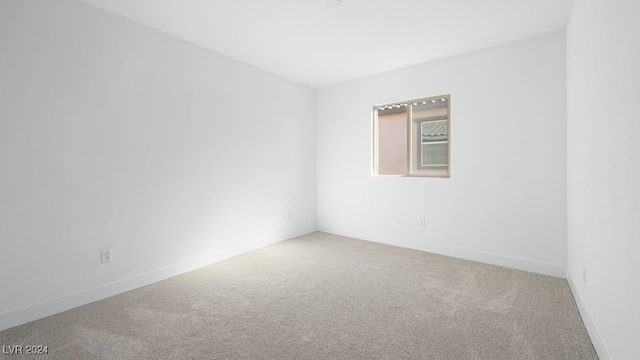 empty room with carpet flooring