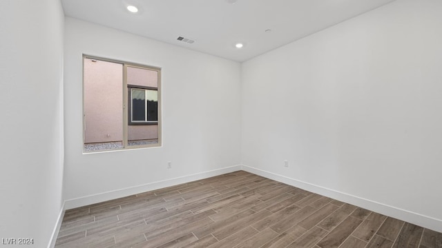 unfurnished room featuring light hardwood / wood-style floors