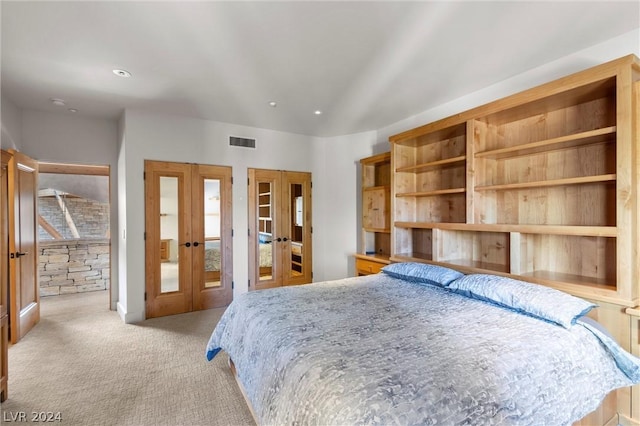 carpeted bedroom featuring french doors