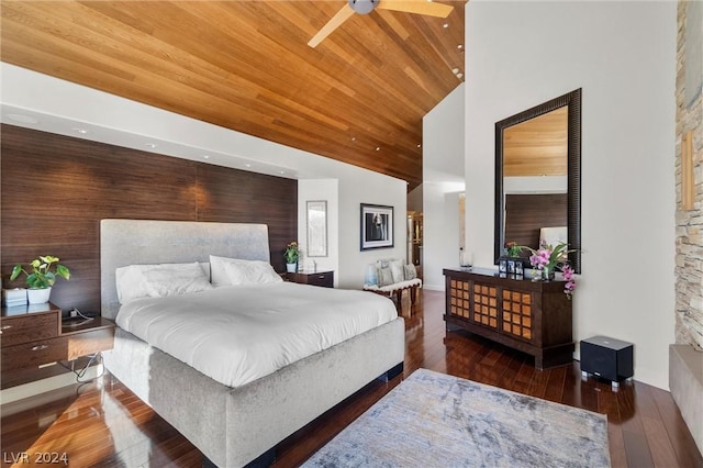 bedroom with dark hardwood / wood-style flooring, wood ceiling, and high vaulted ceiling