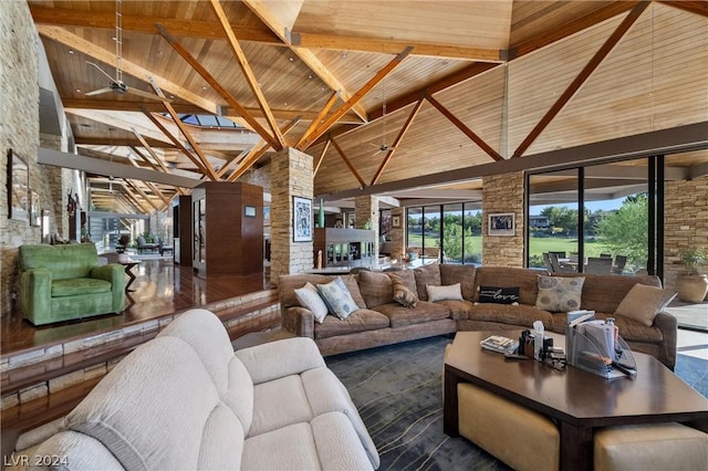 living room featuring wooden ceiling and high vaulted ceiling