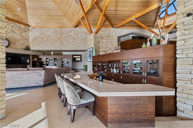 bar with wooden ceiling and high vaulted ceiling