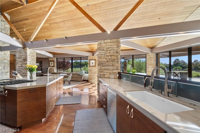 kitchen with sink, wood ceiling, dishwasher, decorative columns, and lofted ceiling with beams