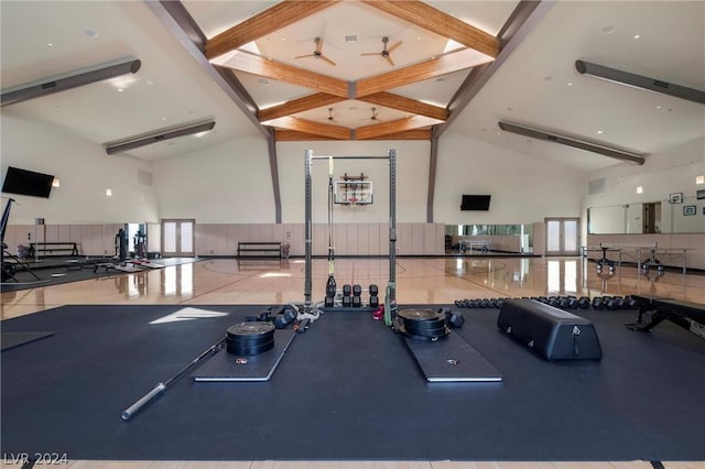 workout area featuring ceiling fan, plenty of natural light, and high vaulted ceiling