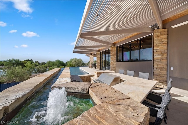 view of patio / terrace with an outdoor kitchen