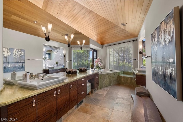 bathroom with a relaxing tiled tub, vanity, wooden ceiling, and lofted ceiling