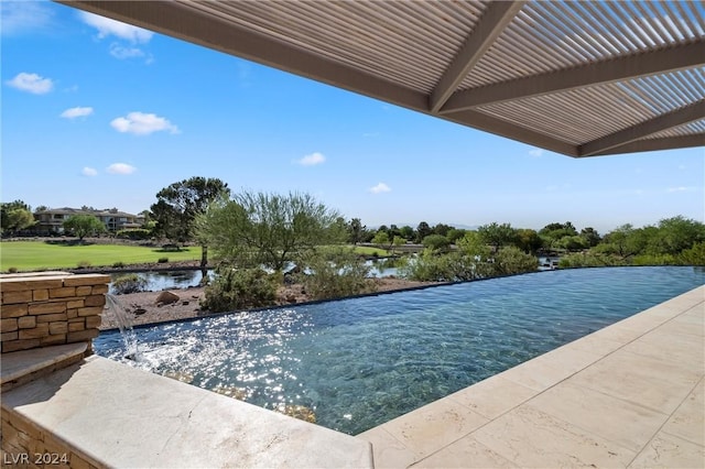 view of swimming pool with a pergola and a water view