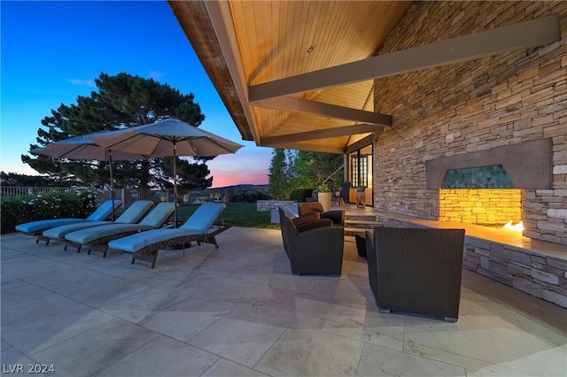 patio terrace at dusk featuring outdoor lounge area