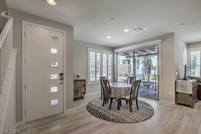 dining room featuring light hardwood / wood-style floors and a wealth of natural light