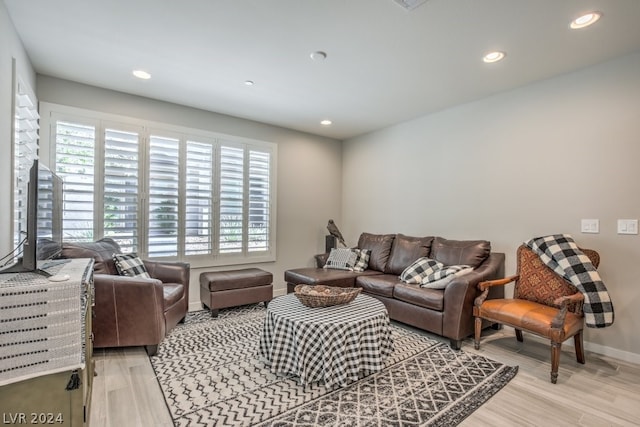 living room with light hardwood / wood-style floors