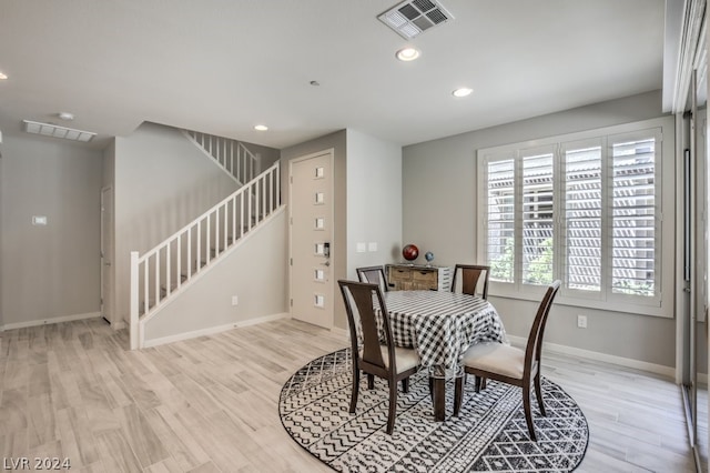 dining space with light wood-type flooring