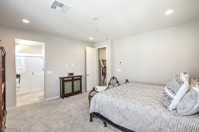 bedroom featuring light carpet