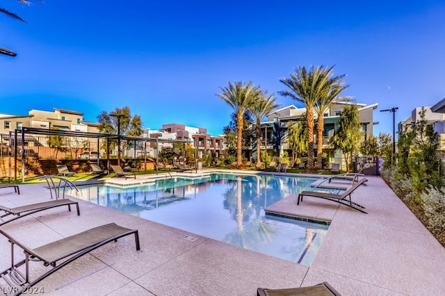 view of swimming pool featuring a patio area