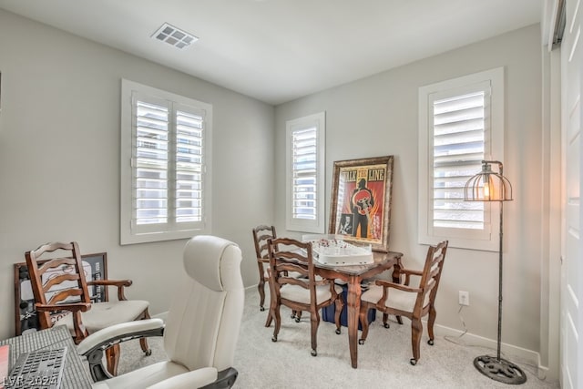 view of carpeted dining area