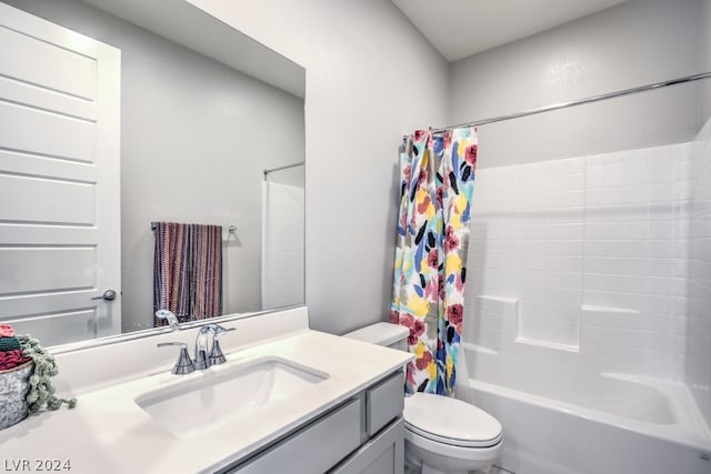 full bathroom with toilet, vanity, and shower / tub combo with curtain