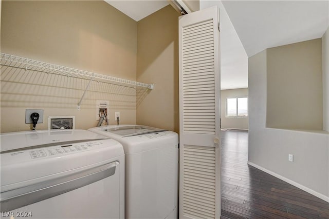 washroom with washing machine and dryer, laundry area, baseboards, and wood finished floors