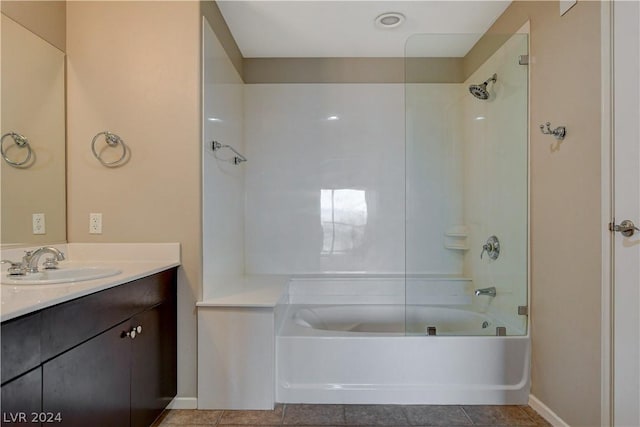 full bath featuring tile patterned flooring, baseboards, tub / shower combination, and vanity