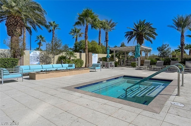 view of pool featuring a community hot tub, a patio, fence, and a pergola