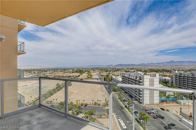 balcony featuring a view of city and a mountain view