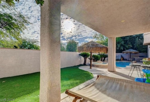 view of yard with a gazebo, a fenced in pool, and a patio