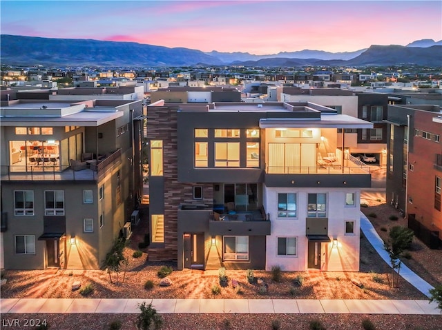 exterior space featuring a mountain view and a balcony