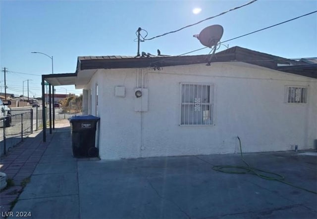 view of side of property with a patio area