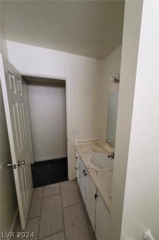 bathroom with vanity and tile patterned floors