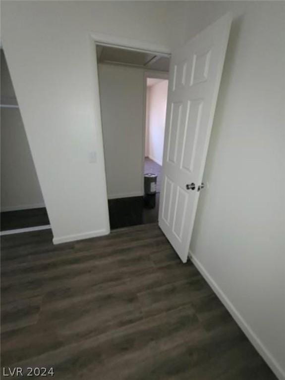 unfurnished bedroom featuring dark hardwood / wood-style floors