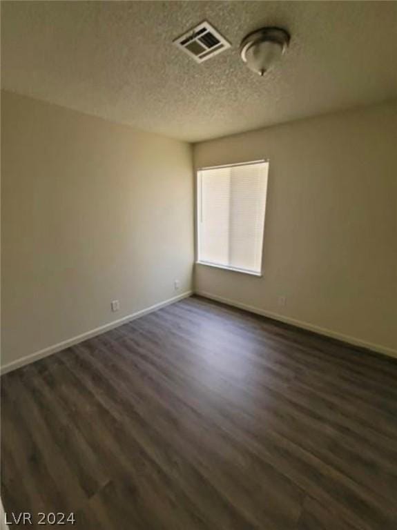 empty room featuring dark hardwood / wood-style floors