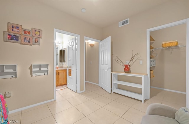 interior space featuring tile patterned flooring and vanity