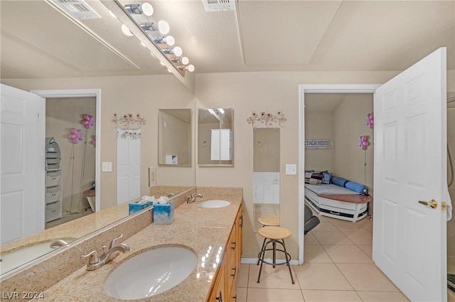 bathroom with tile patterned flooring and vanity