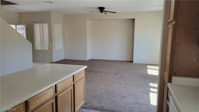 kitchen with light carpet and ceiling fan