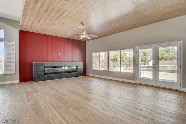 unfurnished living room with ceiling fan, light wood-type flooring, a fireplace, and wooden ceiling