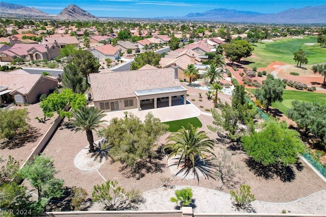 birds eye view of property with a mountain view