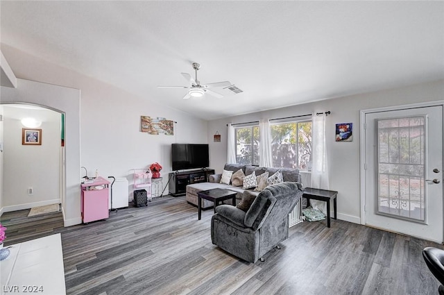 living room with hardwood / wood-style flooring, ceiling fan, and lofted ceiling