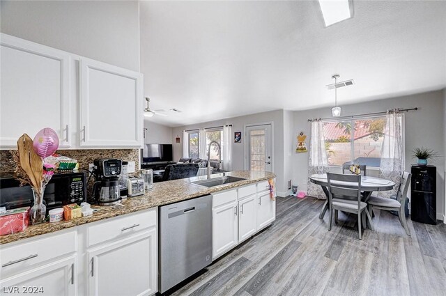 kitchen with white cabinetry, sink, a wealth of natural light, and dishwasher