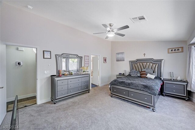 bedroom featuring ceiling fan, carpet floors, and vaulted ceiling