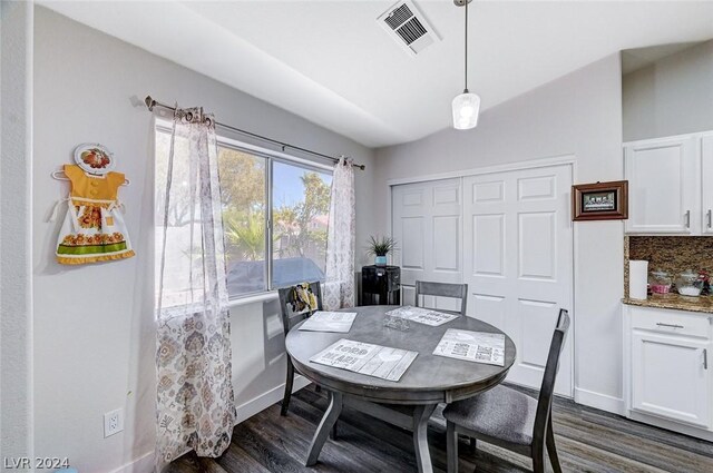 dining area with dark wood-type flooring