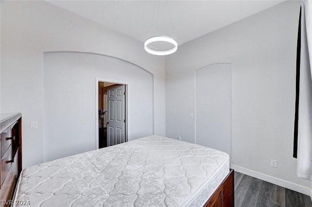 bedroom featuring dark wood-type flooring