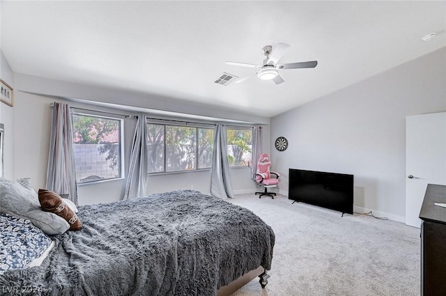 bedroom featuring light carpet and ceiling fan